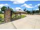 Private gated entrance leading to a well-manicured home, providing security and curb appeal at 3934 Se 110Th St, Belleview, FL 34420