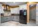 Modern kitchen with stainless appliances and an island with breakfast bar at 3934 Se 110Th St, Belleview, FL 34420