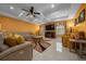 Inviting living room boasts a coffered ceiling, fireplace, and plush seating, perfect for relaxation at 3934 Se 110Th St, Belleview, FL 34420