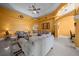 Spacious living room with tile flooring, ceiling fan, and elegant archways at 3934 Se 110Th St, Belleview, FL 34420