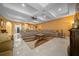 Bright living room featuring tray ceiling, tile floors, and an open layout at 3934 Se 110Th St, Belleview, FL 34420