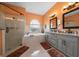 Modern main bathroom with a large tub, walk-in shower, and double vanity with granite countertops at 3934 Se 110Th St, Belleview, FL 34420