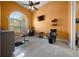 Salon room, featuring chairs, sink, large arched window and light colored tiled flooring at 3934 Se 110Th St, Belleview, FL 34420