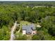 Estate aerial view featuring home surrounded by mature landscaping and trees at 400 Se 90Th St, Ocala, FL 34480