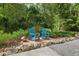 Outdoor space features Adirondack chairs and a peaceful garden setting at 400 Se 90Th St, Ocala, FL 34480