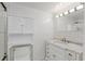 Bathroom featuring an undermount sink and large mirror at 400 Se 90Th St, Ocala, FL 34480