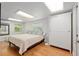 Cozy bedroom with hardwood floors, a large closet, and ample natural light at 400 Se 90Th St, Ocala, FL 34480