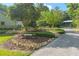 Manicured front yard with mature trees at 400 Se 90Th St, Ocala, FL 34480
