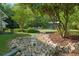 Landscaped front yard with rock garden and yard art at 400 Se 90Th St, Ocala, FL 34480