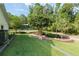 Well-manicured front yard features lush landscaping and a circular driveway, creating a welcoming and picturesque curb appeal at 400 Se 90Th St, Ocala, FL 34480