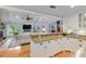Kitchen featuring stainless steel appliances, bar seating, and a view into the living area at 400 Se 90Th St, Ocala, FL 34480