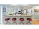 Kitchen featuring a breakfast bar with seating and beadboard accents at 400 Se 90Th St, Ocala, FL 34480