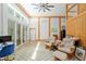 Bright living room with wood beams, comfortable seating, and large windows at 400 Se 90Th St, Ocala, FL 34480