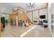 Spacious living room with high ceilings, wood beams, modern fireplace, and open floor plan at 400 Se 90Th St, Ocala, FL 34480