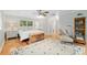 Spacious main bedroom boasts a seating area, wood floors and ample natural light at 400 Se 90Th St, Ocala, FL 34480