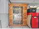 An indoor sauna with wood paneling, a glass door, and glass windows at 400 Se 90Th St, Ocala, FL 34480
