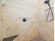 Tiled shower features a bench, and a shower niche with a rainfall shower head at 400 Se 90Th St, Ocala, FL 34480
