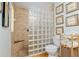 Relaxing shower with glass block, bench, and built-in shelves for storage at 400 Se 90Th St, Ocala, FL 34480