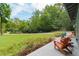 Spacious sideyard featuring patio seating and green landscape at 400 Se 90Th St, Ocala, FL 34480