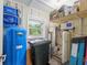 A utility room with a water softener and water tank at 400 Se 90Th St, Ocala, FL 34480