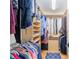 Well-organized walk-in closet featuring shelving, rods for hanging, and built-in storage at 400 Se 90Th St, Ocala, FL 34480