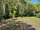Spacious backyard offers privacy with mature trees and plenty of room for outdoor activities at 439 Sw Shorewood Dr, Dunnellon, FL 34431