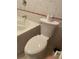 Bathroom featuring a tiled floor and toilet with a roll of toilet paper on top at 439 Sw Shorewood Dr, Dunnellon, FL 34431