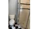 Bathroom featuring a toilet and a glass door shower with a black and white checkered floor at 439 Sw Shorewood Dr, Dunnellon, FL 34431