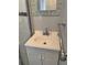 Bathroom featuring a vanity with a white countertop, chrome faucet, chrome towel bar and tile mirror at 439 Sw Shorewood Dr, Dunnellon, FL 34431