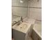 Bathroom featuring tile flooring, vanity with sink, mirror, and a corner bathtub at 439 Sw Shorewood Dr, Dunnellon, FL 34431
