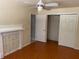 Bedroom featuring a decorative mantle, ceiling fan, and closet with sliding doors at 439 Sw Shorewood Dr, Dunnellon, FL 34431