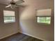 Bedroom with two windows letting in natural light and a ceiling fan at 439 Sw Shorewood Dr, Dunnellon, FL 34431