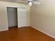 Bedroom with ceiling fan and closet with sliding doors at 439 Sw Shorewood Dr, Dunnellon, FL 34431