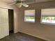 Bedroom with two windows, ceiling fan, and closet at 439 Sw Shorewood Dr, Dunnellon, FL 34431