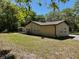 Exterior view of the home showing an enclosed porch and well-maintained landscaping at 439 Sw Shorewood Dr, Dunnellon, FL 34431