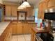 A kitchen featuring tile countertops, a stainless-steel sink, and stainless-steel appliances at 439 Sw Shorewood Dr, Dunnellon, FL 34431