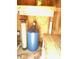 Utility room features water filtration, pump system and a clean, organized storage area at 439 Sw Shorewood Dr, Dunnellon, FL 34431