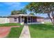 View of the back porch with screened-in patio, open door and brick walkway at 4757 Nw 45Th Ct, Ocala, FL 34482