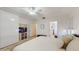 Spacious bedroom with a comfortable bed, modern storage, and ensuite bathroom access at 4757 Nw 45Th Ct, Ocala, FL 34482