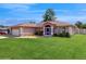 Inviting home showcasing a well-manicured lawn and an attached two-car garage at 4757 Nw 45Th Ct, Ocala, FL 34482