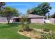 Well-maintained front yard with lush landscaping and tidy garden beds at 4757 Nw 45Th Ct, Ocala, FL 34482