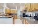 Bright kitchen featuring stainless steel appliances, light wood cabinets, and spacious countertops at 4757 Nw 45Th Ct, Ocala, FL 34482