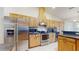 Modern kitchen boasting stainless steel appliances, light wood cabinets, and granite countertops at 4757 Nw 45Th Ct, Ocala, FL 34482