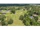 Aerial view of the green golf course near a home within a serene neighborhood at 5326 Nw 76Th Ct, Ocala, FL 34482
