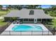 Backyard showcasing a sparkling swimming pool with a lush lawn at 5326 Nw 76Th Ct, Ocala, FL 34482