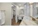 Bathroom with a granite countertop vanity and an opening with view to a bedroom at 5326 Nw 76Th Ct, Ocala, FL 34482