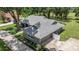 Aerial view of a well-maintained home with lush landscaping and a spacious driveway at 5326 Nw 76Th Ct, Ocala, FL 34482