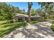 This beautiful home features professional landscaping, newer paint, and an extra long driveway at 5326 Nw 76Th Ct, Ocala, FL 34482