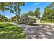 This beautiful home features an updated garage, a well-maintained driveway, and lush landscaping at 5326 Nw 76Th Ct, Ocala, FL 34482