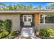 Inviting front entrance featuring double doors, modern lighting, and newly landscaped surroundings at 5326 Nw 76Th Ct, Ocala, FL 34482